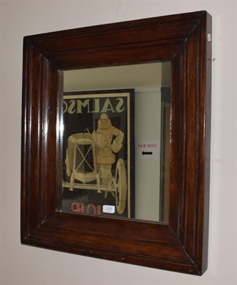 Lot 1127 - An oak framed mirror of square form