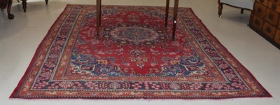 Lot 1134 - Hamadan carpet, the crimson field with central flowerhead medallion framed by spandrels and...