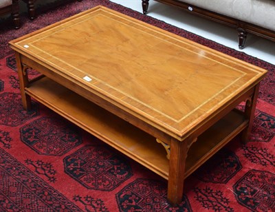 Lot 1144 - A reproduction rectangular two-tier coffee table