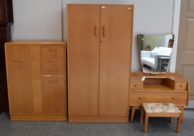 Lot 1149 - A 1960's G-Plan oak veneered three-piece bedroom suite, a similar stool and a single dining chair