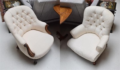 Lot 1157 - Two Victorian mahogany framed cream upholstered button back chairs
