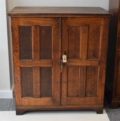Lot 1164 - An oak double door cabinet enclosing eight trays, 112cm wide