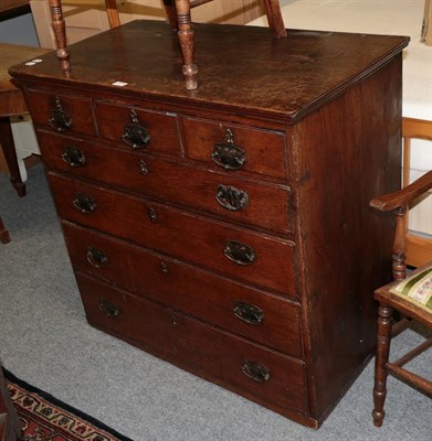 Lot 1171 - A Georgian oak chest of drawers