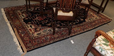 Lot 1178 - Heriz design carpet, India, the indigo field of angular vines around a typical medallion framed...
