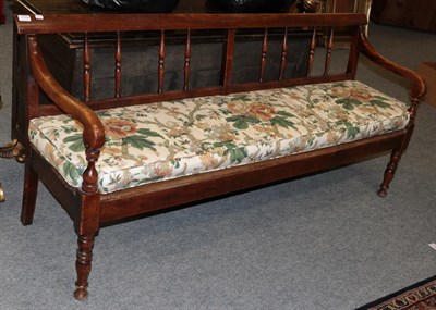 Lot 1179 - A 19th century mahogany spindle back bench