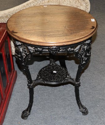 Lot 1184 - A cast iron Britannia pub table with circular moulded top