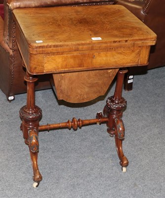 Lot 1189 - A Victorian figured walnut games and sewing table