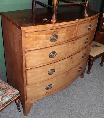 Lot 1197 - A George III mahogany bow fronted four-height chest of drawers (faded), together with a tin...