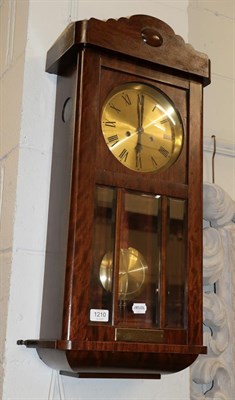 Lot 1210 - A striking wall clock bearing presentation plaque