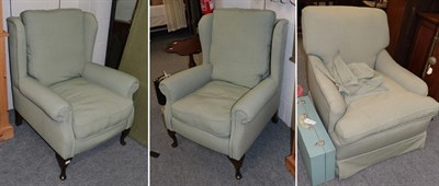 Lot 1215 - Two mahogany framed green upholstered wing chairs; together with a further feather filled...