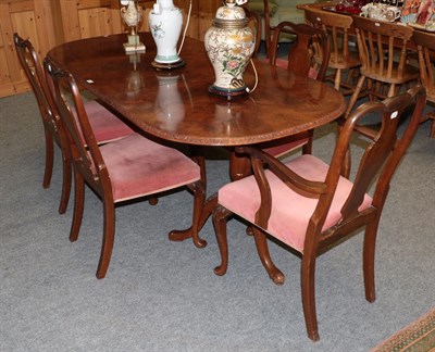 Lot 1217 - A walnut dining table together with a set of six chairs (7)