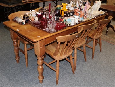 Lot 1220 - A pine farmhouse kitchen table with six matching chairs