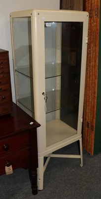 Lot 1222 - A modern painted metal and glazed medical cabinet