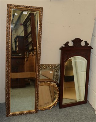 Lot 1233 - An early 20th century brass framed mirror; three gilt mirrors; and an Edwardian carved mahogany...