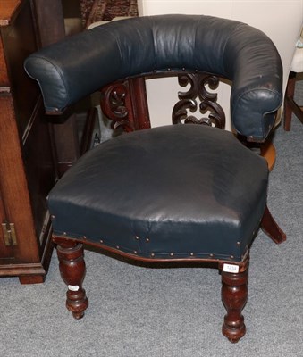 Lot 1234 - A late Victorian carved mahogany and blue leather horseshoe backed club chair