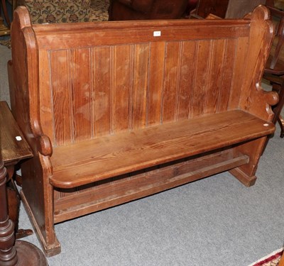 Lot 1238 - A Victorian pitch pine pew, 135cm wide