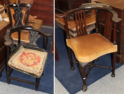 Lot 1248 - An 18th century joined oak corner chair, the carved back with solid splat above outswept arms and a