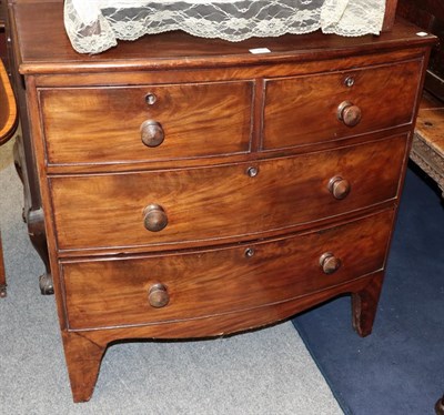 Lot 1250 - A George III mahogany three-height bow fronted chest of drawers