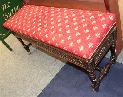 Lot 1256 - A Victorian carved mahogany double piano seat