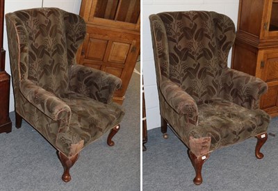 Lot 1270 - A pair of 1920's mahogany framed wing back armchairs
