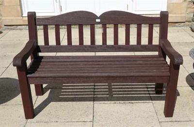 Lot 1276 - A stained hardwood garden bench