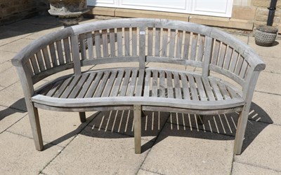 Lot 1277 - A curved garden bench