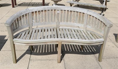 Lot 1278 - A curved garden bench
