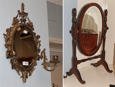 Lot 1294 - A brass twin-light girandole and a dressing mirror (2)