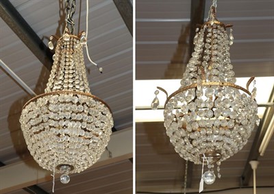 Lot 1302 - A large lustre drop bag three-light ceiling light; together with a smaller example (2)