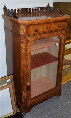 Lot 1305 - A Victorian figured walnut pier cabinet with a three-quarter gallery