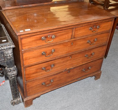 Lot 1311 - A George II mahogany five-drawer straight fronted chest