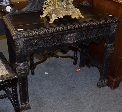 Lot 1312 - A 19th century carved oak side table