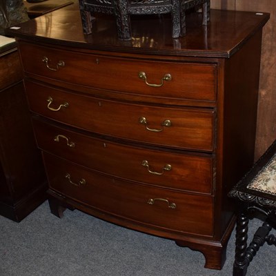 Lot 1314 - A George III style mahogany bow fronted chest of drawers