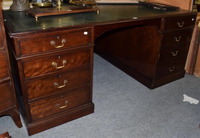 Lot 1315 - A 20th century mahogany and leather top partners desk in the Georgian style