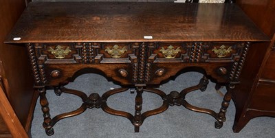 Lot 1317 - A 1920s oak two drawer table in the 17th century style