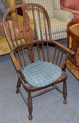 Lot 1324 - A 19th century elm Windsor armchair