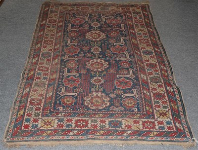 Lot 1333 - Kuba rug, the mid indigo field of stylised flowerheads enclosed by Harshang borders, 186cm by 120cm