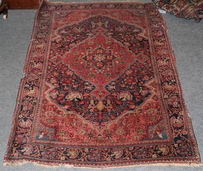 Lot 1334 - Saroukh rug, the field of angular vines and a tomato red medallion enclosed by meandering vine...