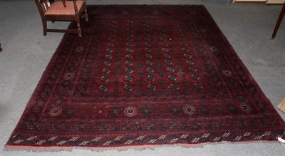 Lot 1349 - A Bukhara style rug, the central red field of medallions with conforming narrow borders