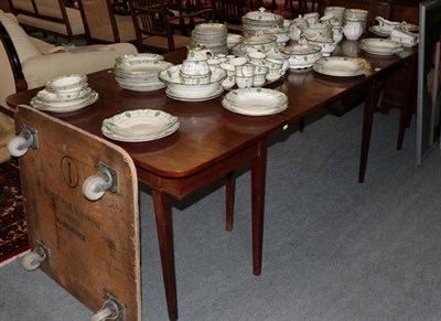 Lot 1351 - A George III mahogany dining table with tapering square section legs, continuing to feet