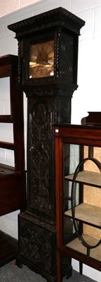 Lot 1357 - A carved oak thirty hour longcase clock, square brass dial signal on a silvered arched plaque. Will