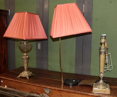 Lot 1362 - A champleve, gilt metal and onyx table lamp, a gilt metal and alabaster oil lamp with glass...