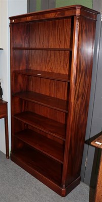 Lot 1365 - A reproduction free standing bookcase with adjustable shelves