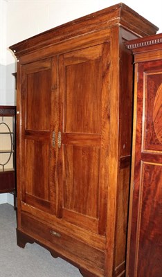 Lot 1368 - An 18th century French armoire with cupboard doors enclosing hanging space, with a deep drawer...