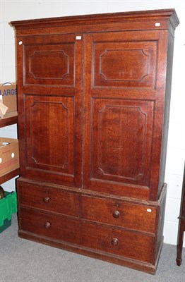 Lot 1371 - A late 18th century oak and pine lined linen press, with two short and one long drawer