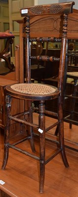 Lot 1376 - A Regency stained beech child's correction chair