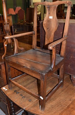 Lot 1381 - An 18th century elm Country open armchair