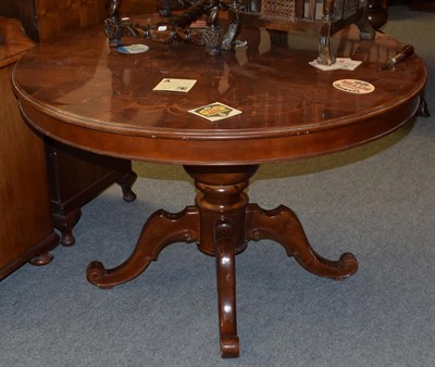 Lot 1385 - An Italian reproduction walnut marquetry decorated pedestal dining table, 120cm diameter by...