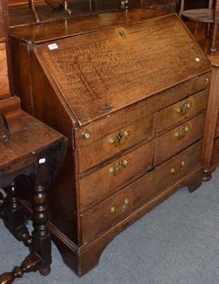 Lot 1392 - A George II oak bureau