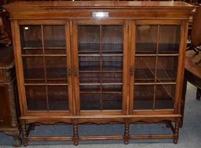 Lot 1418 - An early 20th century oak cabinet with presentation plaque 'To Reverend JHP Welby'